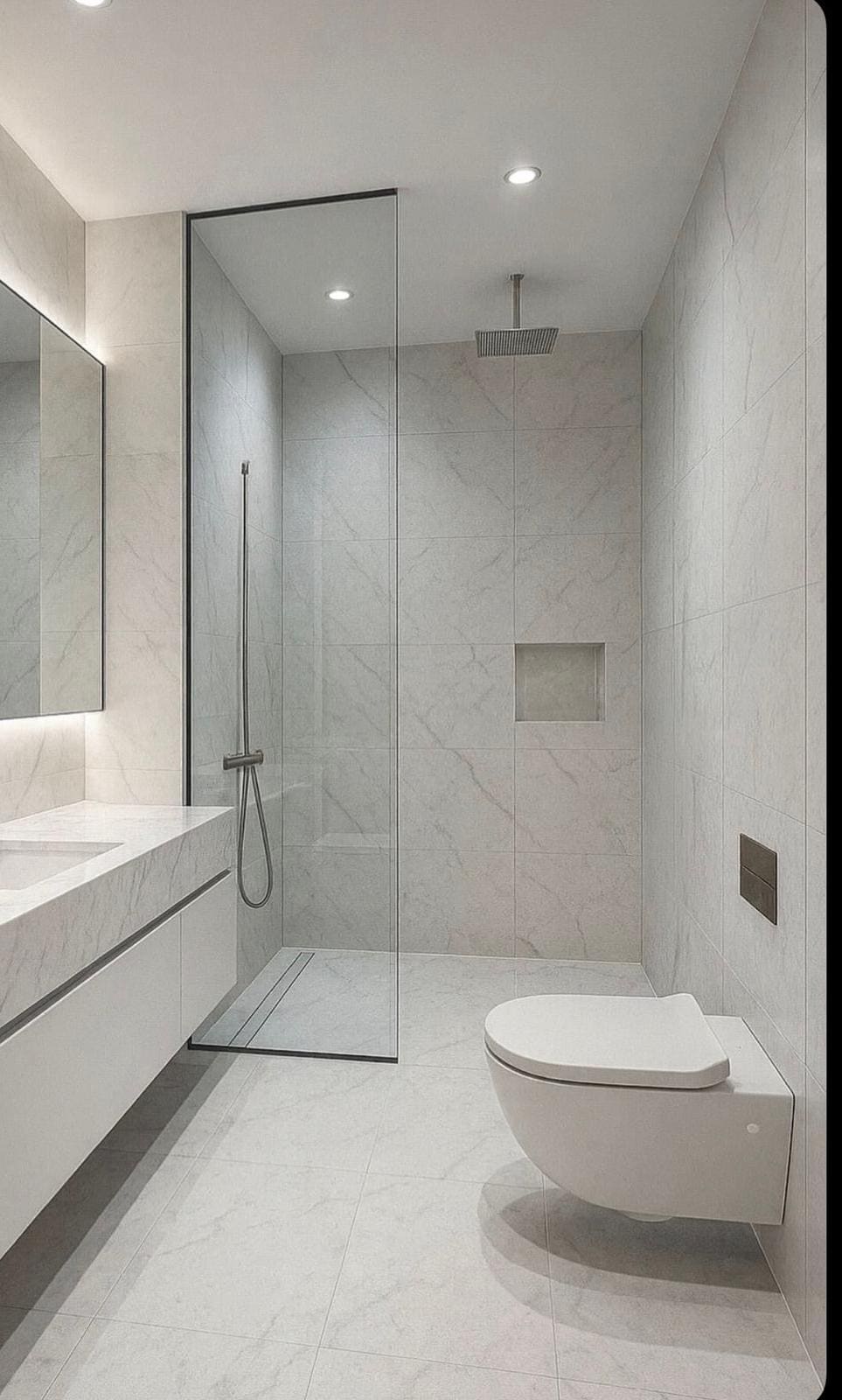 Bathroom renovation with marble-look tile and glass shower