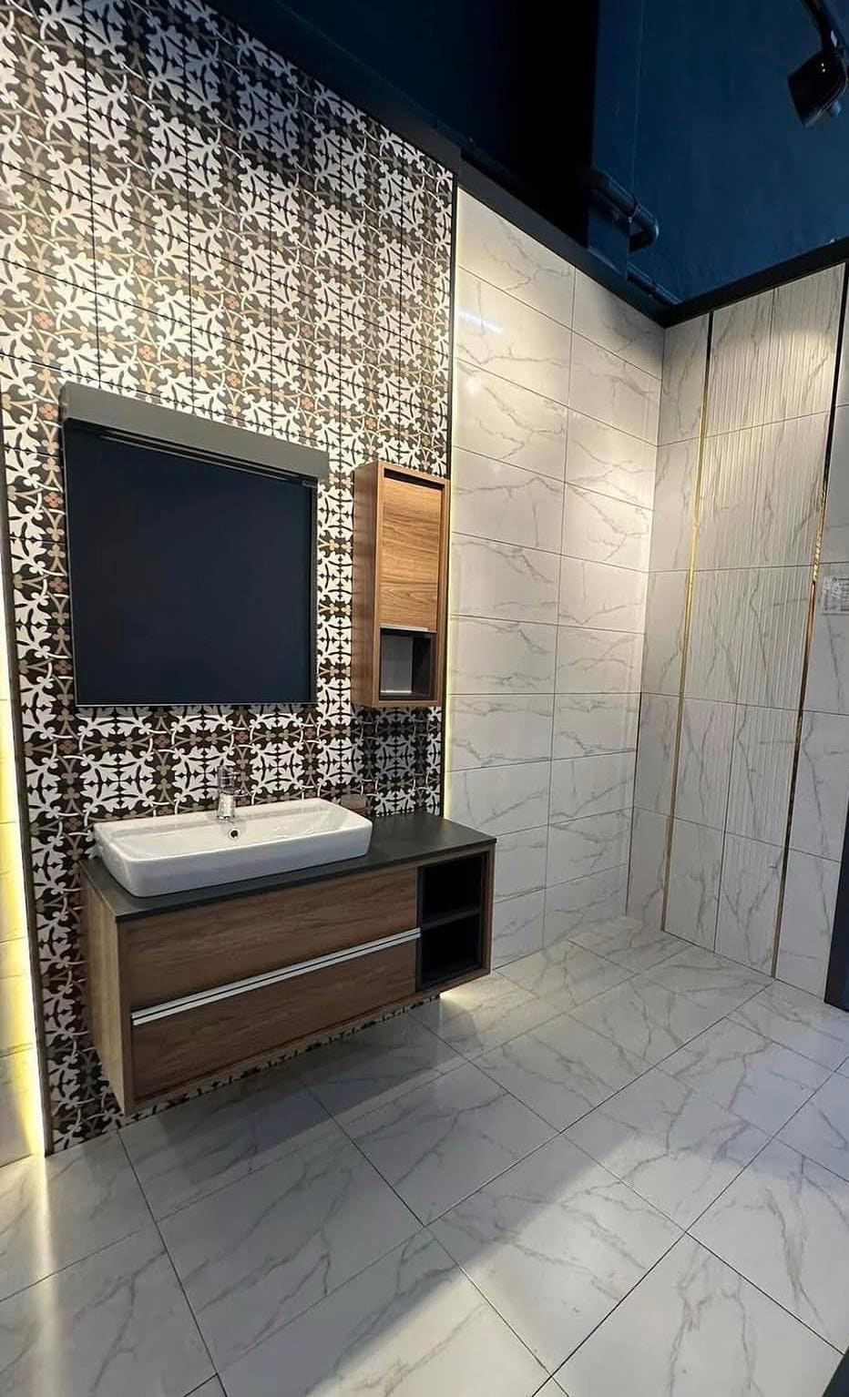 Bathroom vanity renovation with patterned accent tile