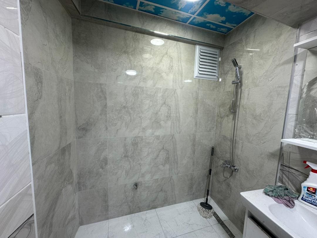 Tiled shower renovation with new fixtures